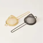 D-Still Fine Strainer 100mm Gold and black finishes side-by-side, highlighting conical mesh bowls and bent wire handles.