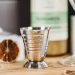 Close-up of the D-Still Multi Level Jigger 75ml Stainless Steel showing engraved volume markings on the polished tapered cup.