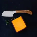 Stanley Rogers Mini Cleaver in use on slate with cheese, featuring a broad steel blade and riveted wooden handle.