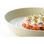 Tablekraft Urban Loft pistachio ceramic bowl close-up showing concentric ridges and wide rim while holding a salmon and dill dish