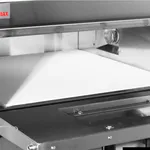 Bakermax Compact Countertop Double Deck Electric oven close-up showing lower deck interior with white tray and red MAX logo