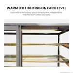 Close-up interior of the Bonvue Heated Display Cabinet H Sf840v showing warm yellow LED strips under glass shelves within a stainless steel frame.
