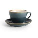Olympia Kiln Ocean Cup side view on matching saucer, featuring dark teal glaze, blue-grey band, and raw tan rim.