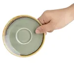 Olympia Kiln Moss Saucer close-up showing matte sage-green glaze and textured brown rim