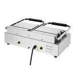 Angled close-up of the Apuro Bistro Contact Grill - Double showing its brushed stainless steel base, two ribbed plates, and yellow-ringed control knobs.