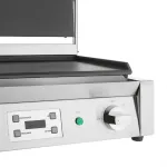 Close-up of the Apuro Double Contact Grill's front-left corner, showing the black non-stick plate and control panel with digital display and rotary dial.