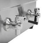 Close-up of the Apuro Double Induction Fryer's stainless steel side panel featuring two chrome drain valves with black levers.