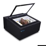 Bonvue gelato display case angled close-up with hinged glass lid open, revealing chocolate and vanilla scoops inside the matte black unit.