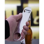 Olympia Bartenders Blade St/St stainless steel bottle opener in use, close-up of hand prying a cap