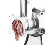 Apuro Heavy Duty Meat Mincer Size 22 in use, close-up of the stainless steel star plate extruding pink meat.