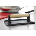 Close-up of the Deglon Sabatier 1.2kg cast iron steak weight with a light wood handle, showing the black rectangular base and upright supports.