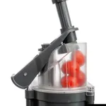 Dito Sama Prep4you Vegetable Slicer in use, close-up side view of clear bowl with red tomatoes and black pusher handle