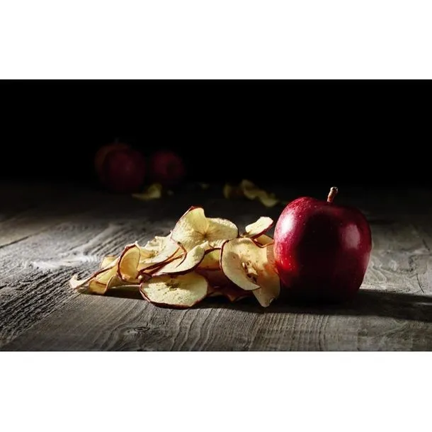Waring Commercial Dehydrator 10 Tray close-up of dried apple slices and a whole red apple on a dark wooden surface