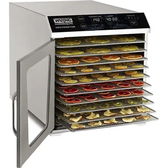 Waring Commercial Dehydrator - 10 Tray, three-quarter view with door open revealing stacked wire-mesh trays holding sliced fruits.
