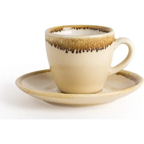 Olympia Kiln Sandstone Saucer in use under a matching cream cup, featuring a textured sandy-brown rim and matte finish.