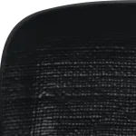 Close-up of the corner of the Luzerne rectangular share plate, showing the matte black surface with a fine, woven grid texture and rounded edge.