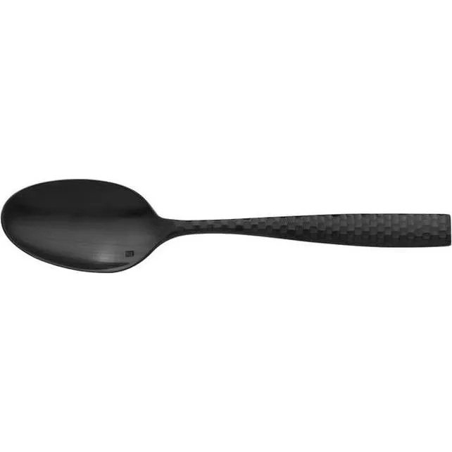 Fortessa Lucca matte black dessert spoon in profile, featuring a faceted honeycomb handle and square logo on the bowl.