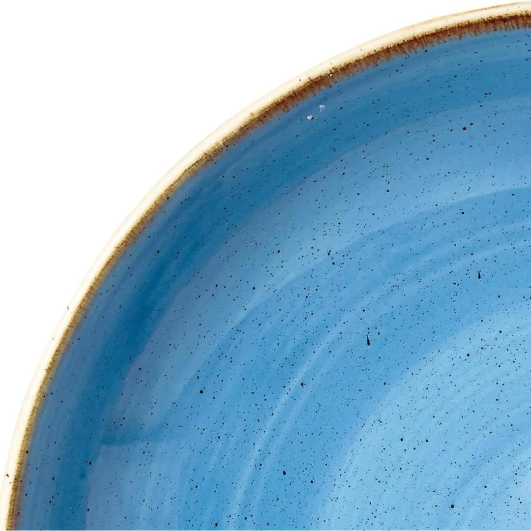 Churchill Round Coupe Bowl close-up showing the interior's glossy light-blue speckled glaze and curved unglazed tan rim.