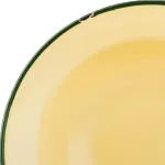 Luzerne Round Bowl close-up of the rim showing a glossy pale-yellow enamel interior and a dark green rolled edge with a small chip.